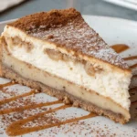 Churro cheesecake Recipe slice on white plate with cinnamon sugar
