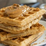 protein waffles stacked with almond butter