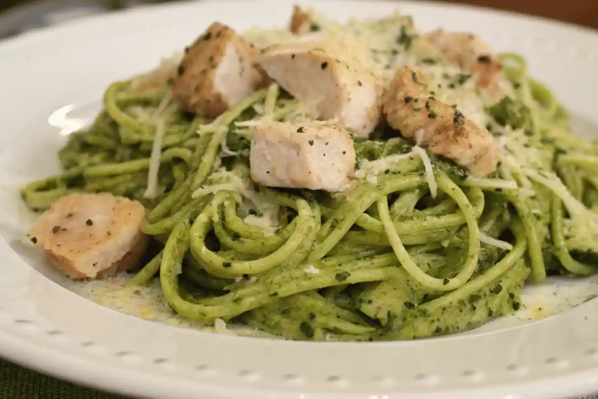 Plate of zucchini noodles with grilled chicken and homemade pesto