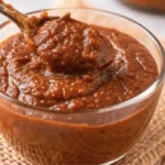 Spoonful of homemade Hello Fresh Tex Mex paste in a glass bowl on burlap