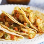 Shrimp and cheese Tacos Gobernador recipe on a white plate