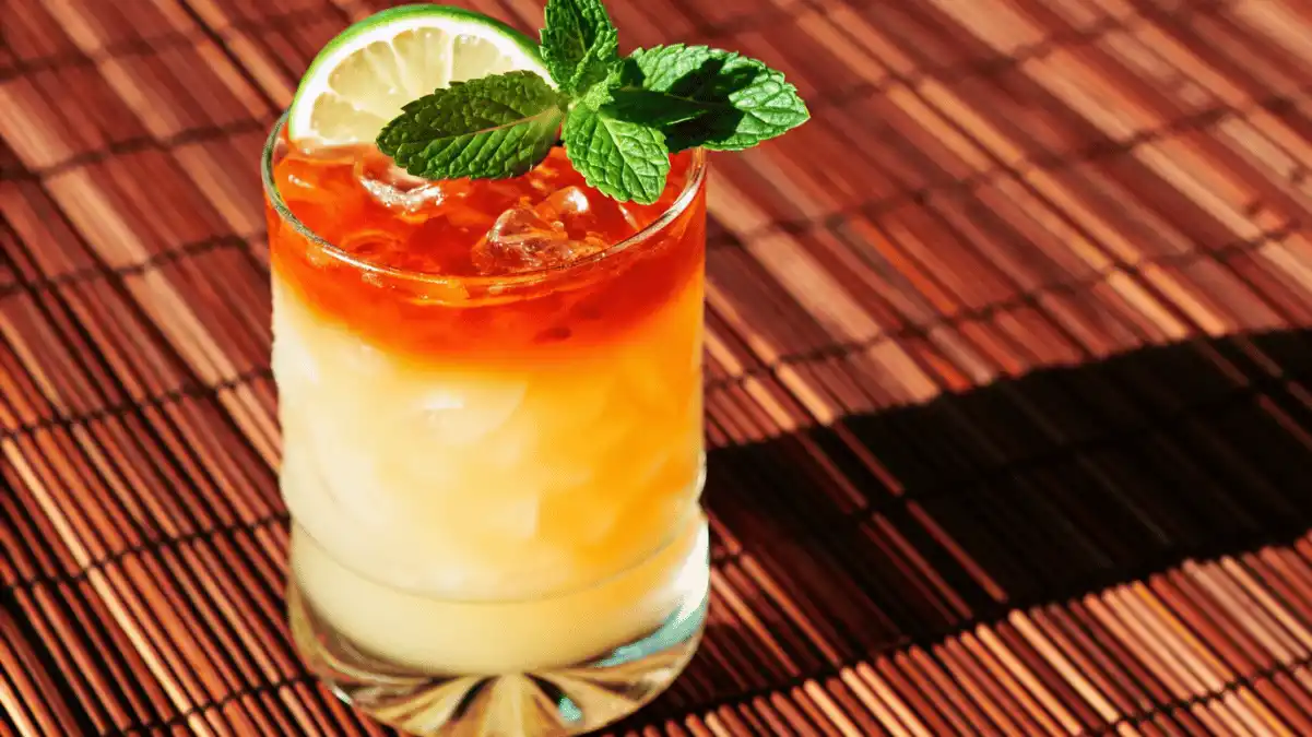Perfect Mai Tai recipe cocktail with rum float, lime, and mint garnish